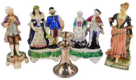 A Royal Dux pottery figure, modelled as a gentleman in 18thC dress playing a flute, printed marks, 18cm high, together with further unnamed figure groups depicting a maiden beside a pillar, 19cm high, a male and female figure in 17thC dress, 18cm high, an