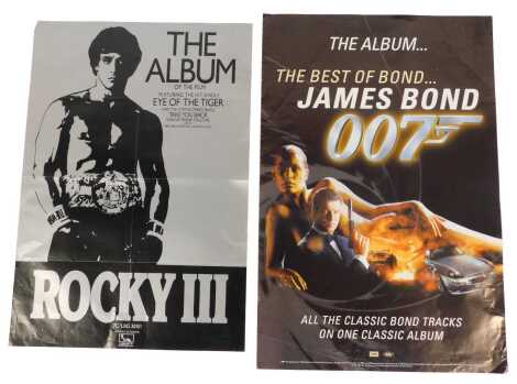 Two video shop posters, for Rocky III, folded, 71cm x 49cm, and The Best of James Bond the Album, 76cm x 50cm.