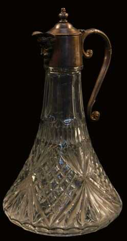 A 20thC moulded glass claret jug, with metal mount and Bacchus mask spout, 31cm high.