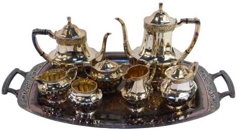 A Community Plate Coronation pattern tea and coffee service, comprising coffee pot, teapot, two twin handled lidded sugar bowls, an open sugar bowl and two cream jugs, together with a twin handled tray.