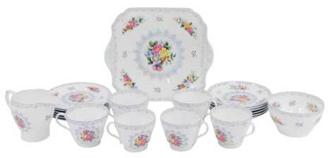 A Shelley porcelain part tea service decorated in the Crochet pattern, comprising six teacups and saucers, six side plates, a sandwich plate, a milk jug and a sugar bowl.