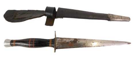 A fighting knife, with leather bound grip and alloy pommel, with leather sheath.