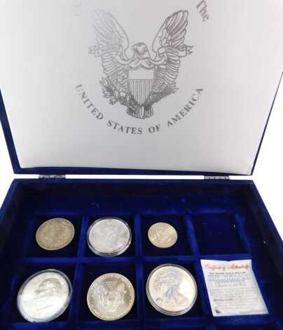 Various Official Silver Coins of the United States of America, to include a 1992 silver proof United States silver eagle, a US silver eagle dollar hologram edition, Morgan dollar, etc.