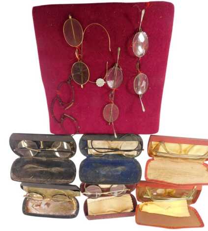 A group of 20thC spectacles, some cased.