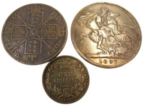 An 1897 Queen Victoria crown, together with an 1889 double florin and an 1872 shilling with dye mark.