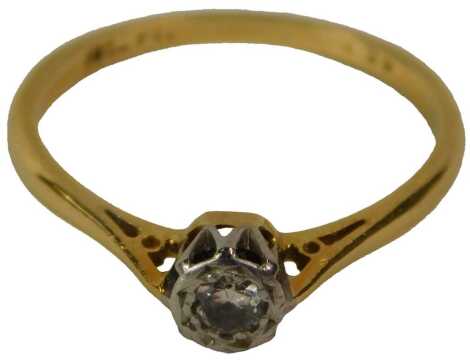 A diamond solitaire ring, in yellow and white metal claw setting, with approximately 0.1ct diamond, stamped 18ct, size O, 2g.