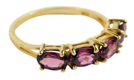 A 14ct gold dress ring, set with four pink Topaz, size N/O, 2.3g.