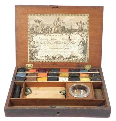 A 19thC artist's paint box, by W J Reeves & Woodyear, Number 80 Holborn-Bridge, London, containing 24 Armorial stamped paint tablets and mixing bowl, in a fitted interior, bears paper label, 28.5cm wide.