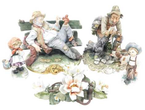 A group of Capodimonte porcelain figures, comprising a tramp on a bench, 25cm wide, hunter with hound and dead pheasant, 26cm high, a pair of figures, designed by T Galli, of a boy with an ewer and a girl with a basket of flowers, 16cm high, together with