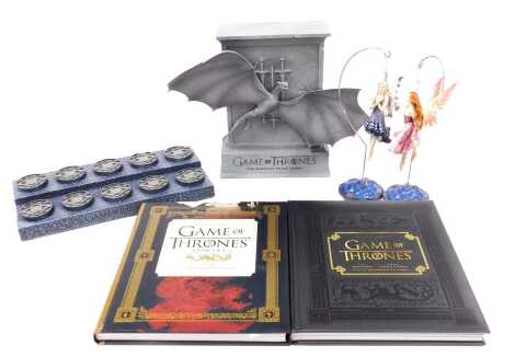 Cogman (Bryan) and Taylor (C. A.) Inside HBO's Game of Thrones and Game of Thrones, seasons 3 & 4, 2 vols., published by Comical Books, San Fransico 2012 & 2014, with slipcase, together with a Game of Thrones figure stand, 31cm wide and a Game of Thrones 