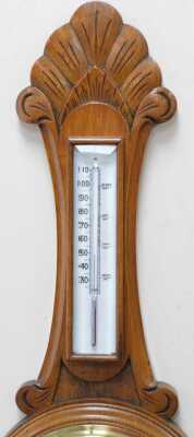 A Victorian oak cased wheel barometer, with a circular white enamelled dial, and thermometer, the case of carved foliate form, 83cm high. - 3