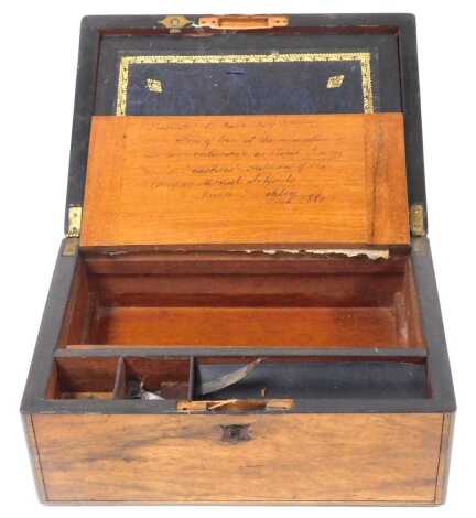 A Victorian rosewood writing slope, brass bound, the hinged lid opening to reveal a fitted interior with gilt tooled green leather slope, 30cm wide.