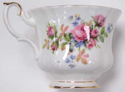 A Royal Albert porcelain Moss Rose pattern tea and coffee service, including graduated teapots, coffee pot, sucrier, sugar bowls, cream and milk jugs, tea and coffee cups, saucers, plates, bread plates, teapot stands, etc. (a quantity) - 2