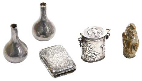 A Victorian silver vesta case, with engraved foliate decoration, circular reserve, presentation engraved, Birmingham 1886, 0.84oz, a continental chatelaine container, repousse decorated with a huntsman with hound, white metal, bears marks, 0.99oz all in, 