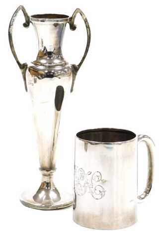 An Edward VII silver christening tankard, monogram engraved, Birmingham 1902, 1.84oz, together with a George V loaded silver twin handle vase, Chester 1916, 2.66oz all in, 16cm high. (2)