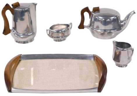 A Picquot ware five piece tea set, comprising teapot, hot water jug, cream jug, sugar bowl and tray.