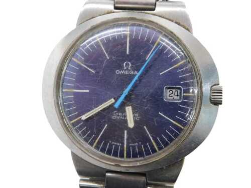 A 1970s Omega stainless steel dynamic wristwatch, circular blue dial, with batons, centre seconds, date aperture, in an oval casing, on a bracelet strap. Upon initial inspection, the watch is ticking but not bench tested. Scratches to the glass, general s