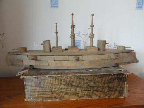 An early 20thC wooden block build model battleship