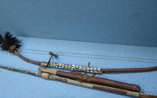 Tribal Art. Shell mounted bow with arrows and a staff. (3)