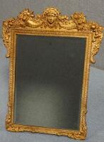 A Baroque style parcel gilt effect plaster dressing table mirror