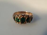 A ladies 9ct pearl and green stone ring