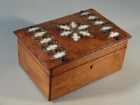 A mahogany workbox incorporating an earlier studded walnut blotter cover.