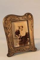 An Edwardian Art Nouveau silver photograph frame