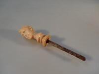 A 19thC carved ivory stick finial of the Duke of Wellington.