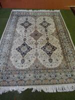 A modern cream ground Persian style rug