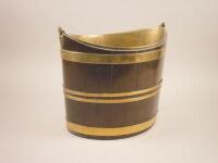 A George III mahogany and brass oval navette shaped bucket