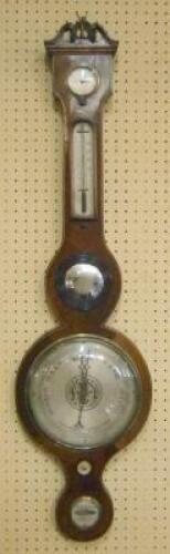 A mid 19thC wheel barometer signed Barnascone of Sheffield