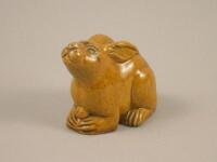 A Chinese stoneware model of a yellow rabbit