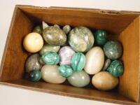 A collection of malachite and various marble eggs etc