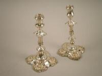 A pair of 19thC silver plated candlesticks