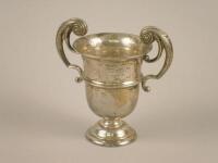 A silver two handled trophy cup bearing the inscription "The Earl of Harrington's Hunt Point to Poin