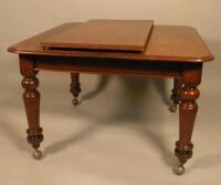 A Victorian mahogany extending dining table