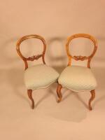 A pair of Victorian mahogany balloon back dining chairs