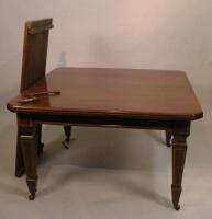 An Edwardian mahogany and satinwood banded extending dining table