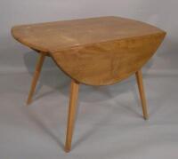 An Ercol Elm drop leaf kitchen table