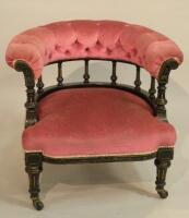 A Victorian ebonised tub shaped chair