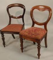 An associated set of eight Victorian mahogany balloon back dining chairs