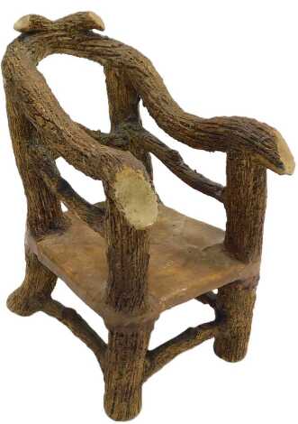 A 19thC fantasy faux bois stoneware chair, possibly Scottish, the wood effect frame with a deep texture, 24cm high.