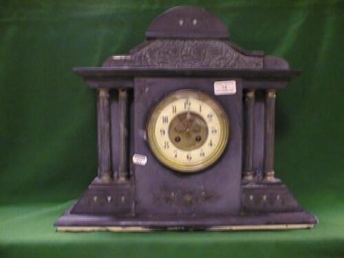 A 19thC slate mantel clock of architectural outline