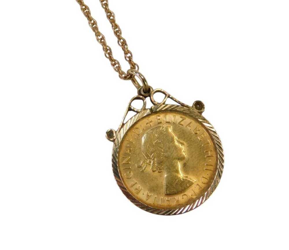 An Elizabeth II full gold sovereign, dated 1968, in a 9ct gold pendant ...