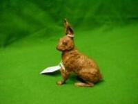 A cast bronze figure of a seated hare