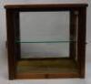 A small table top display cabinet converted from a balance scale case.