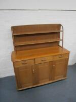 An Ercol sideboard with plate rack