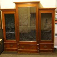 A Victorian walnut breakfront display cabinet