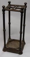 *A Victorian cast iron stick stand with removable tray