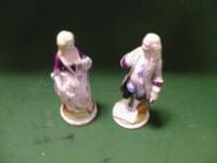 A pair of German porcelain figures of a lady and gentleman